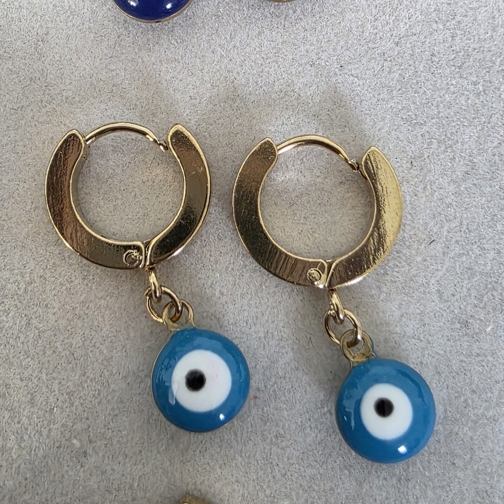 Gold Stainless Steel Huggie Hoop Earrings with Evil Eye Charm - Picture 7 of 17